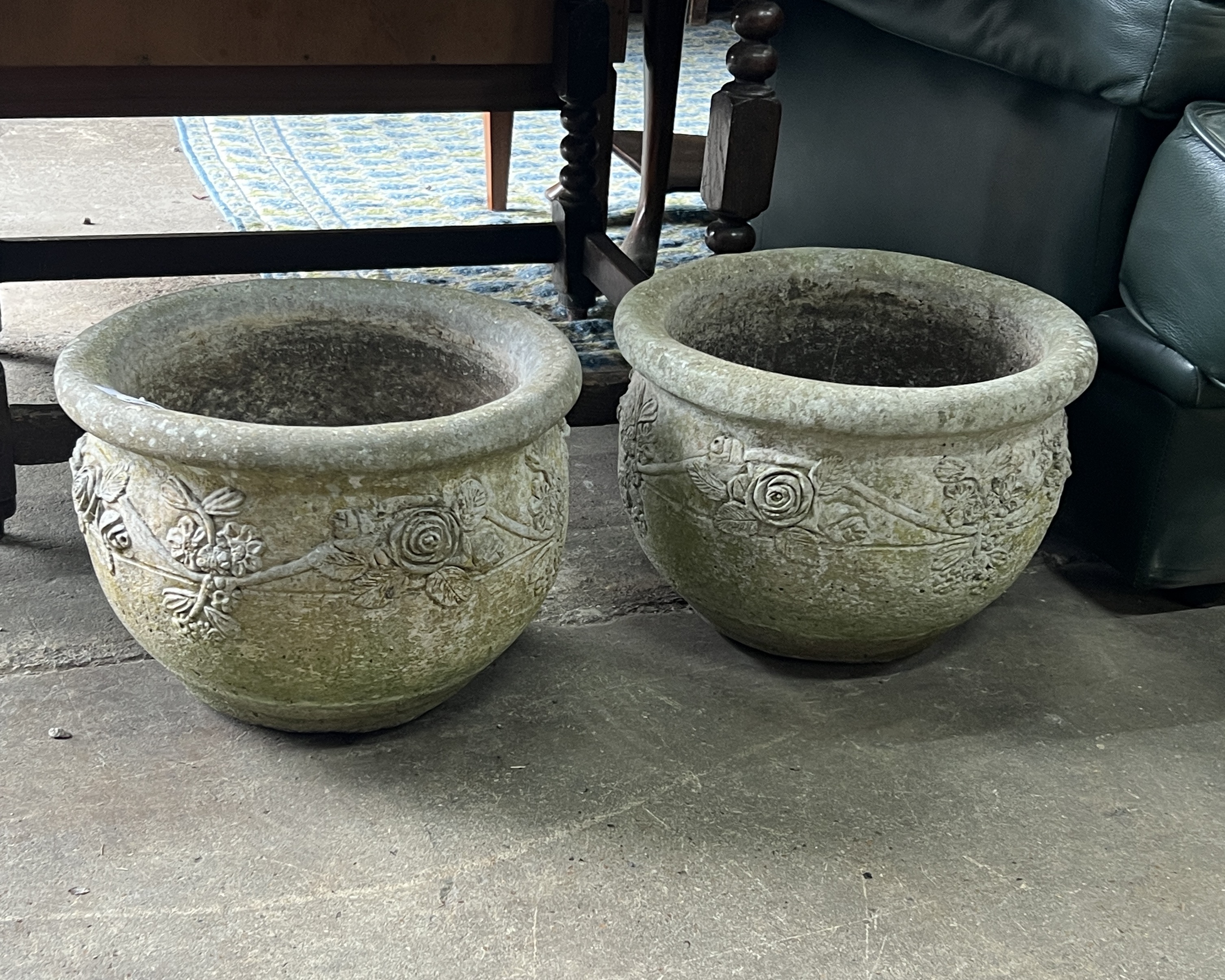 A pair of circular reconstituted stone garden planters, diameter 37cm, height 26cm